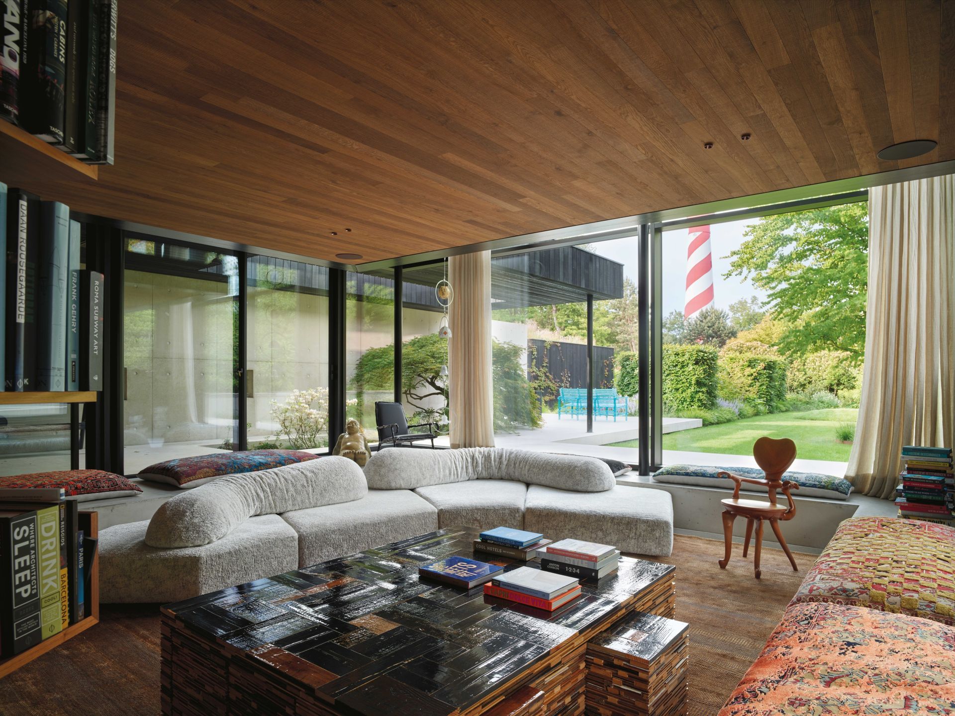   On the Rocks.  The sofa opens up a 360-degree view of the landscape in the villa’s living area. Artworks by Maarten Baas, Piet Hein Eek and Anton Gaudì. 