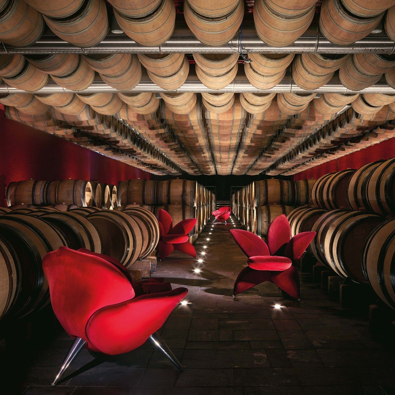  Flower Collection. Getsuen and Rose Chair in Velvet echo the colours of the surrounding walls in the barrique cellar. 
