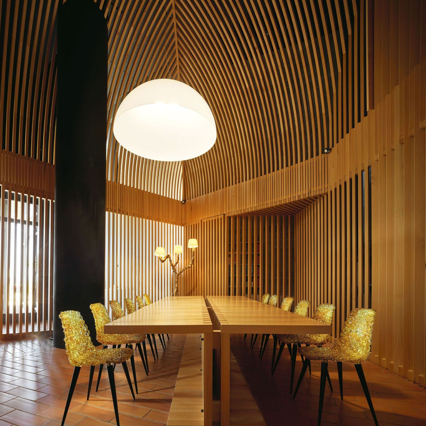  Gina and Ines. Next page, the chairs and lamp with their reflections illuminate the wood and brick interior in one of the winery’s rooms. 