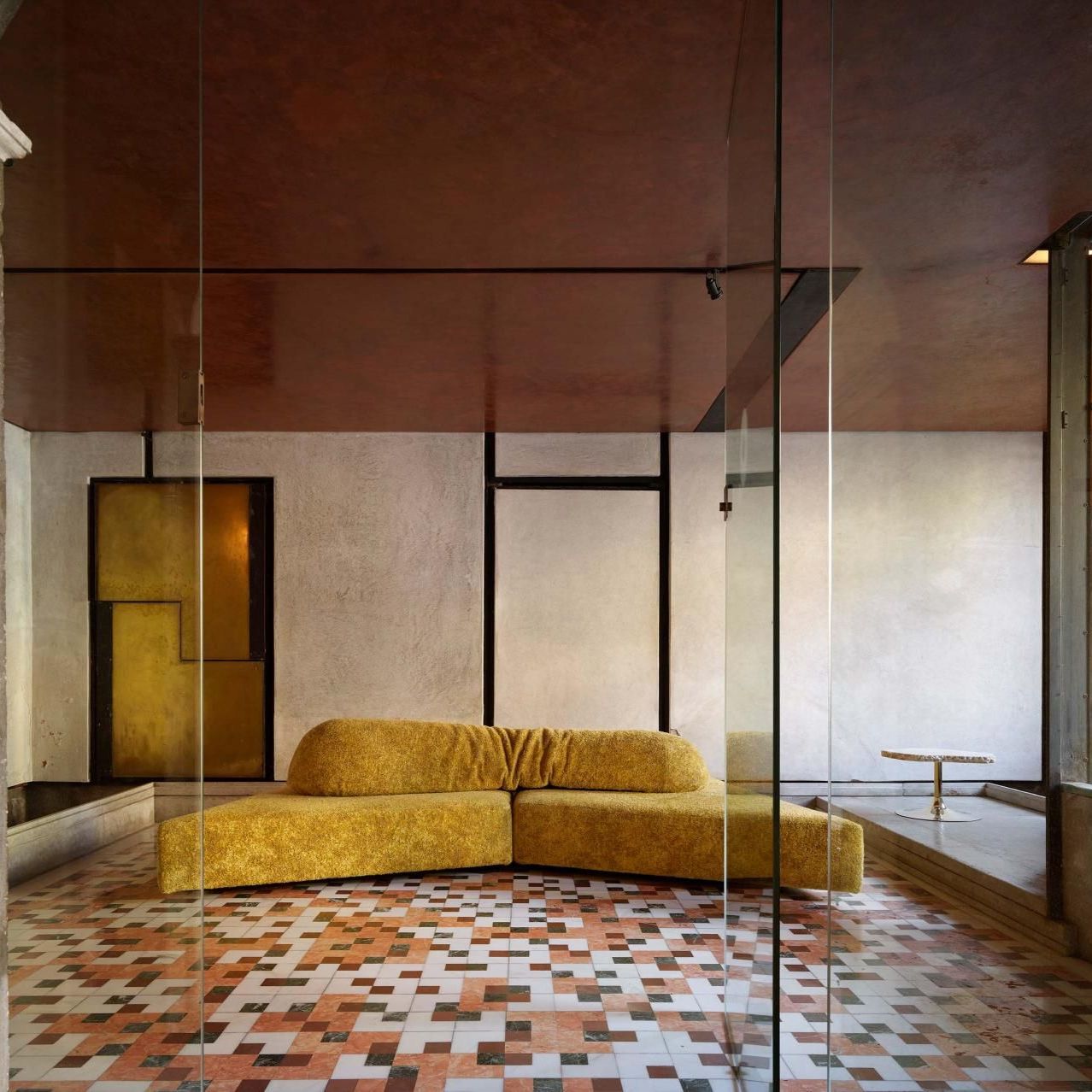  On the Rocks upholstered in Imperial Royal Yellow Every Stone on the checkerboard floor of the atrium, with polychrome marbles echoing the red stucco ceiling. 