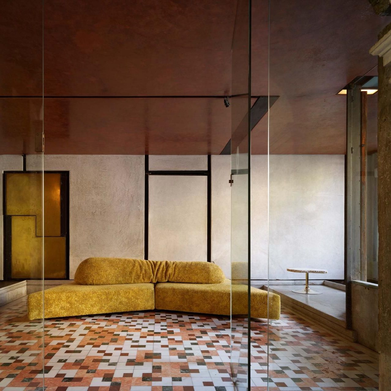  On the Rocks and Cicladi. 
upholstered in Imperial Red Every Stone on the checkerboard floor of the atrium, with polychrome marbles echoing the red stucco ceiling. 