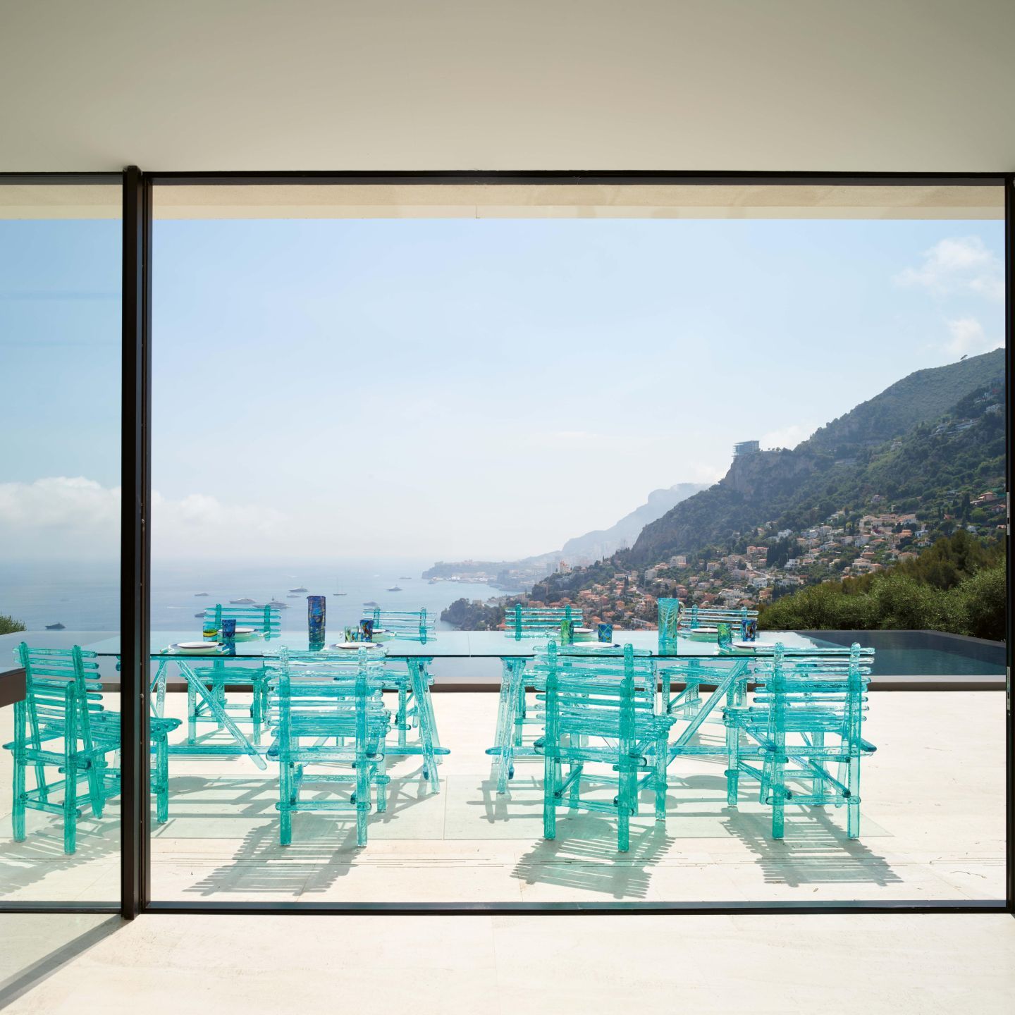  The chairs and table from the  A'mare  collection on the sun deck of the infinity pool. 