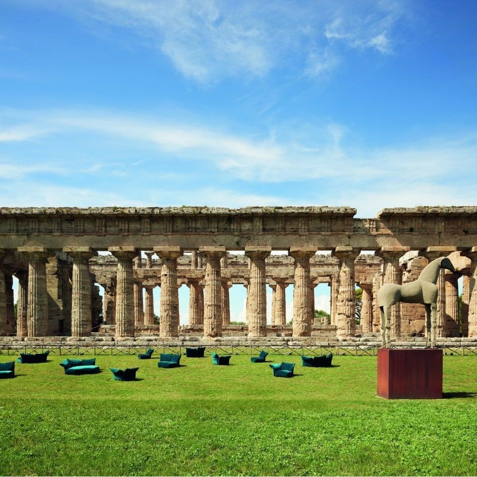  Standard outdoor. A sweep of sofas covered in cobalt Every Place at the Temple of Neptune. 