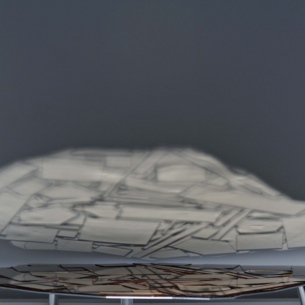  Brasilia. 
The table with an aluminium top featuring a mosaic of mirror shards. 