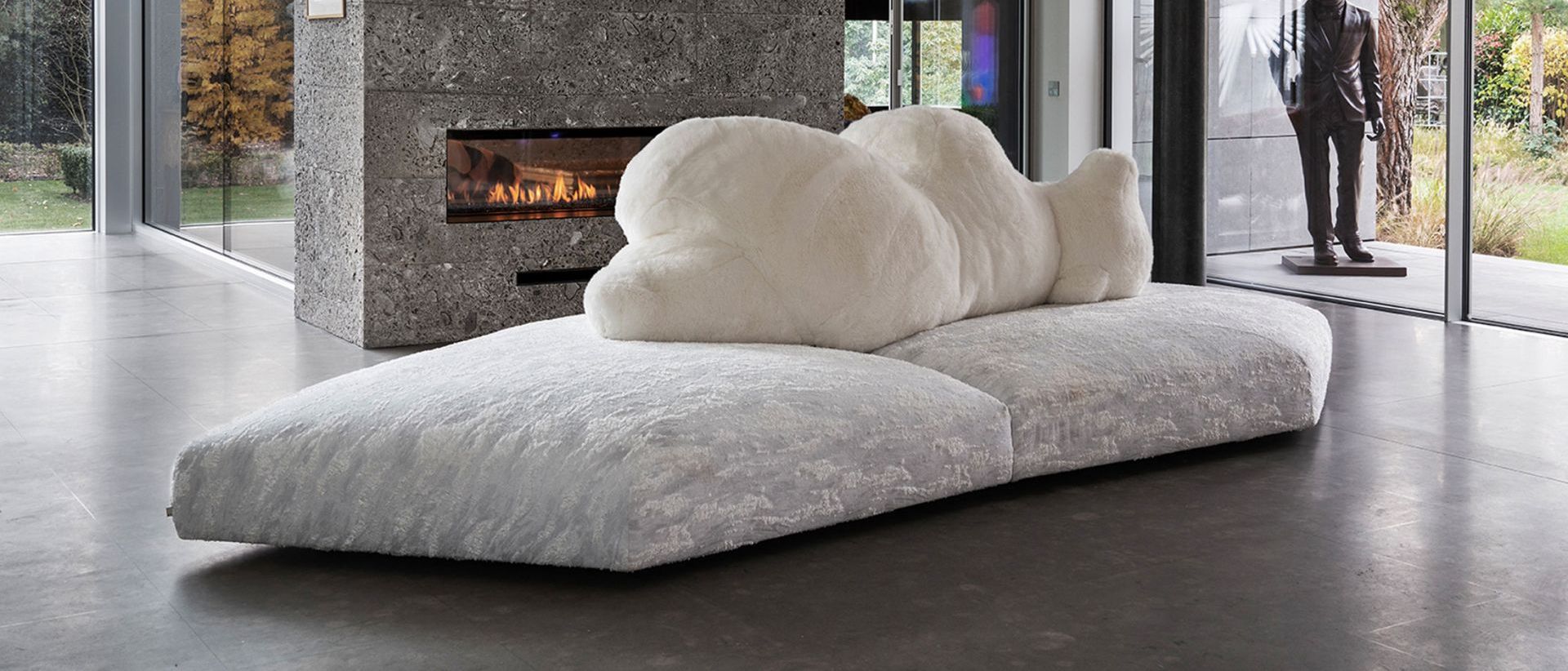 Pack . in front of the chimneypiece covered in Ceppo del Gré stone