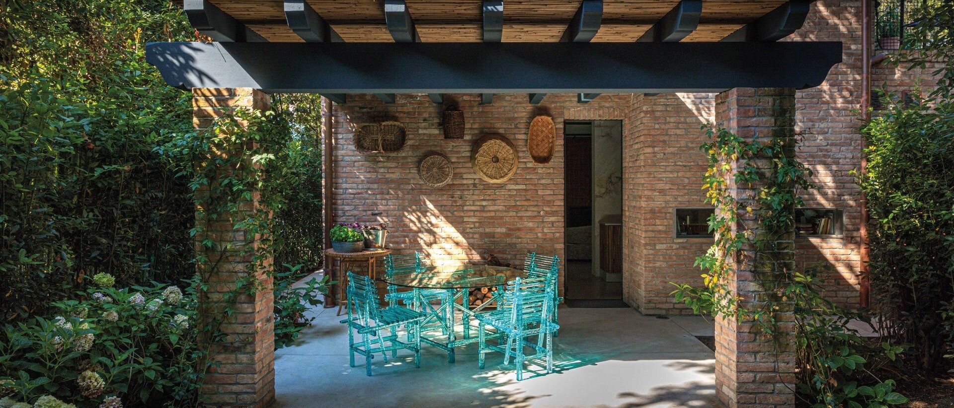   A'mare . The chairs and the dining table in the patio that gives on the kitchen. 