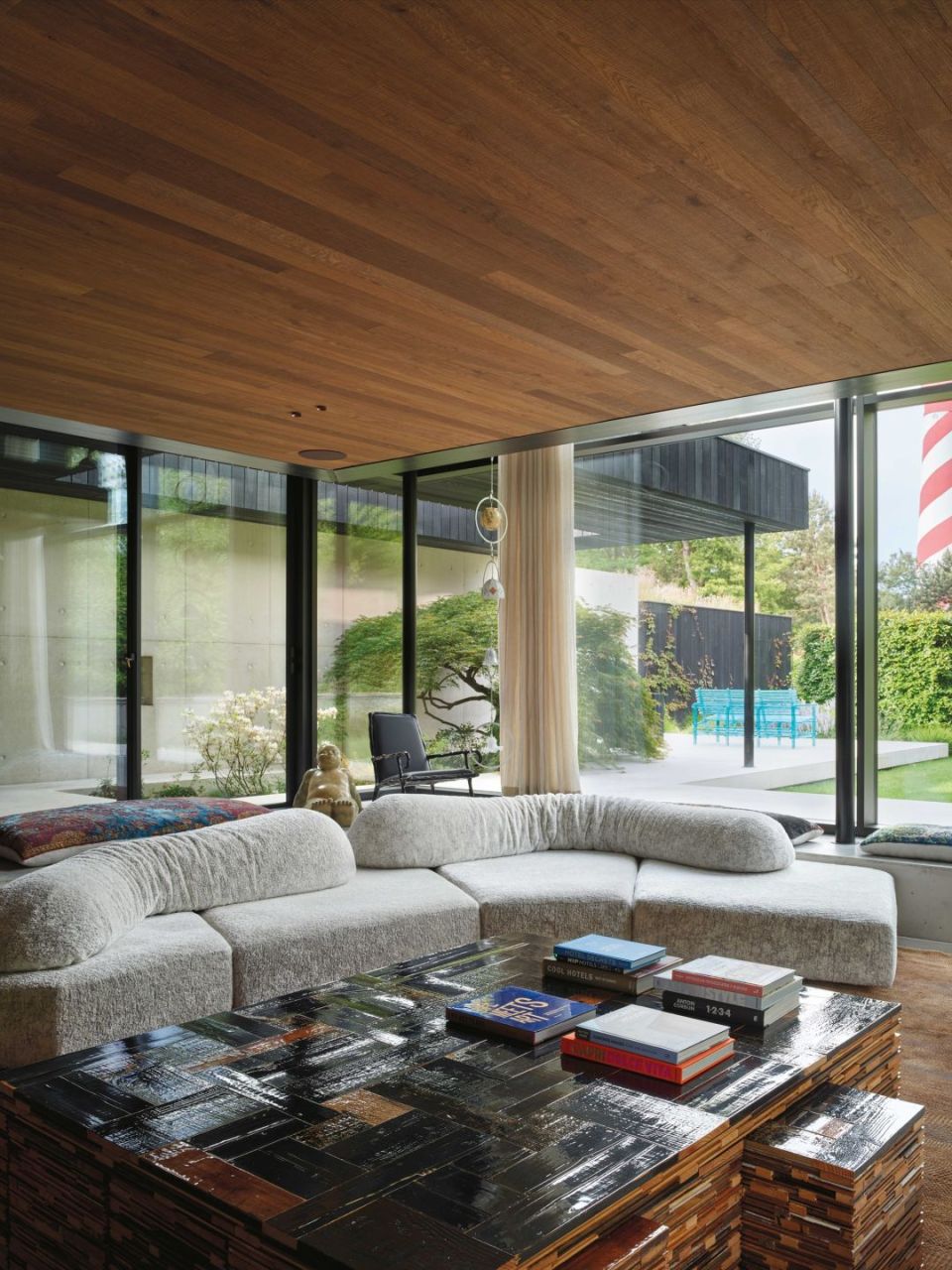   On the Rocks.  The sofa opens up a 360-degree view of the landscape in the villa’s living area. Artworks by Maarten Baas, Piet Hein Eek and Anton Gaudì. 
